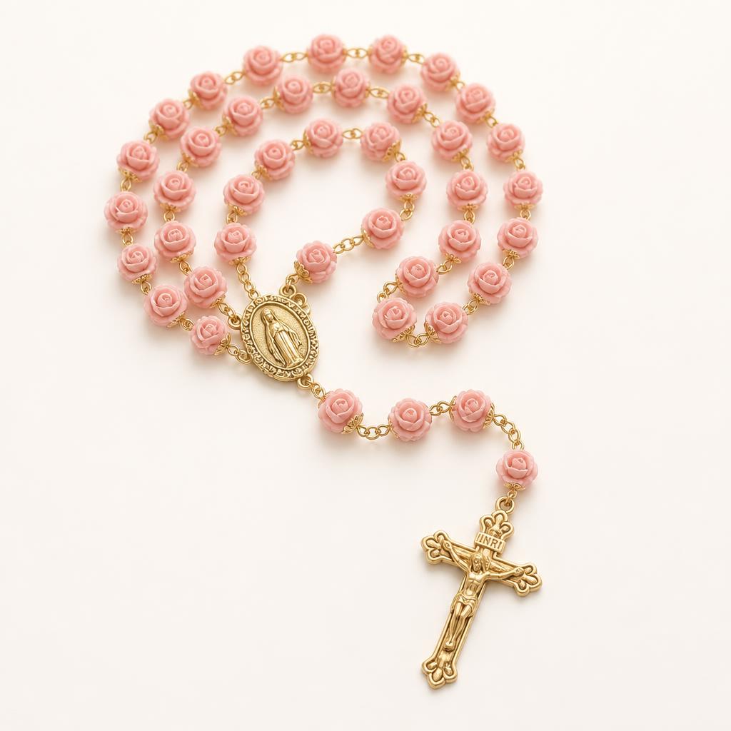 Rose-shaped pink bead rosary with a gold crucifix and Marian centrepiece