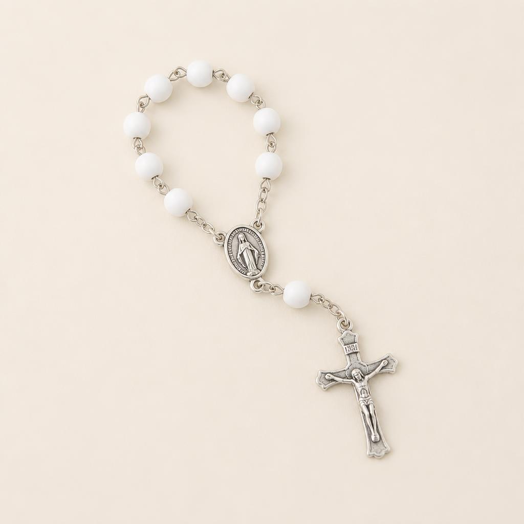 Small white bead decade rosary with a silver Marian centrepiece and crucifix